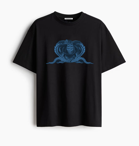 Black t-shirt with blue graphic design of an octopus on a white background.