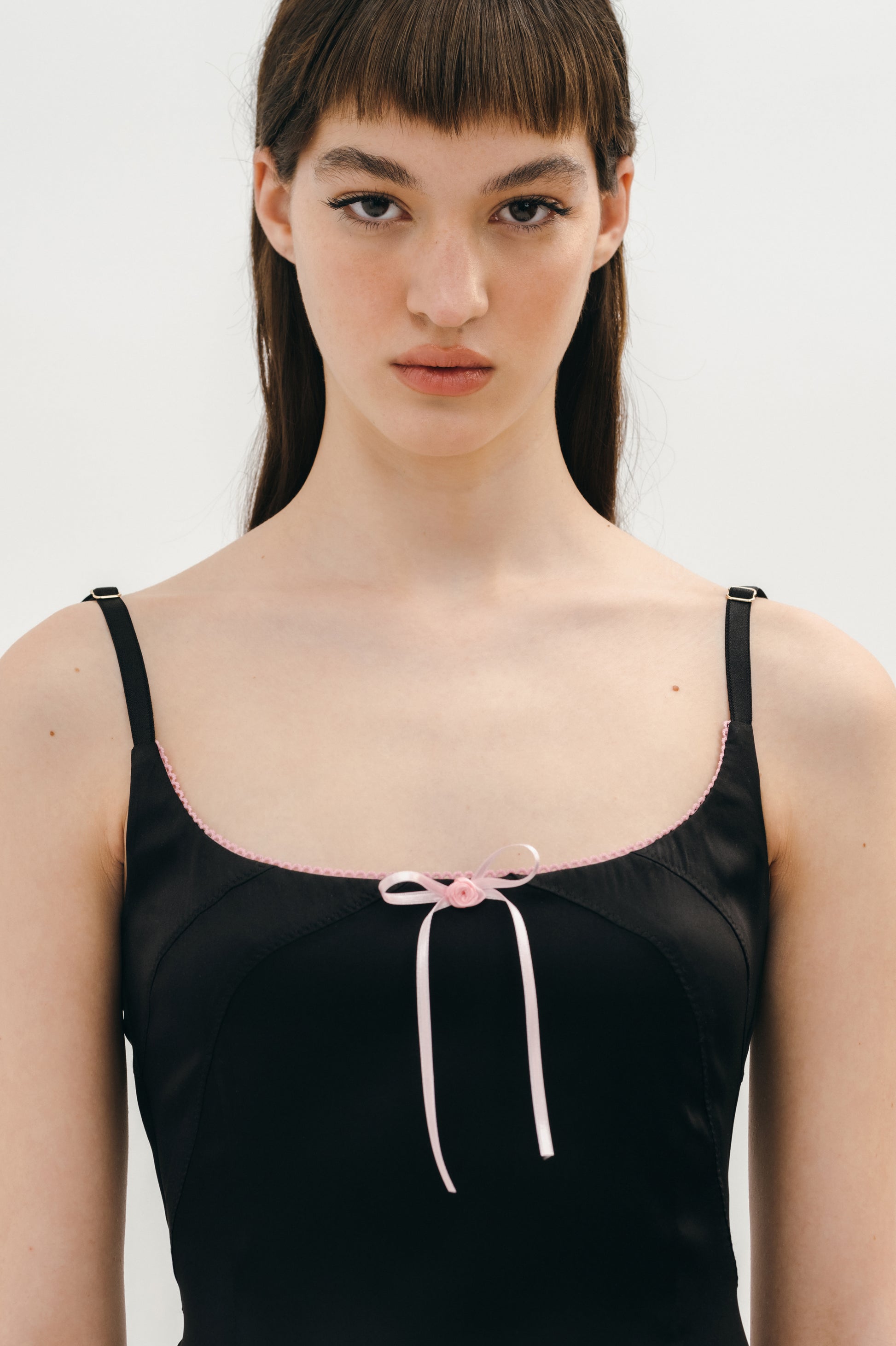 Black satin dress with pink bows